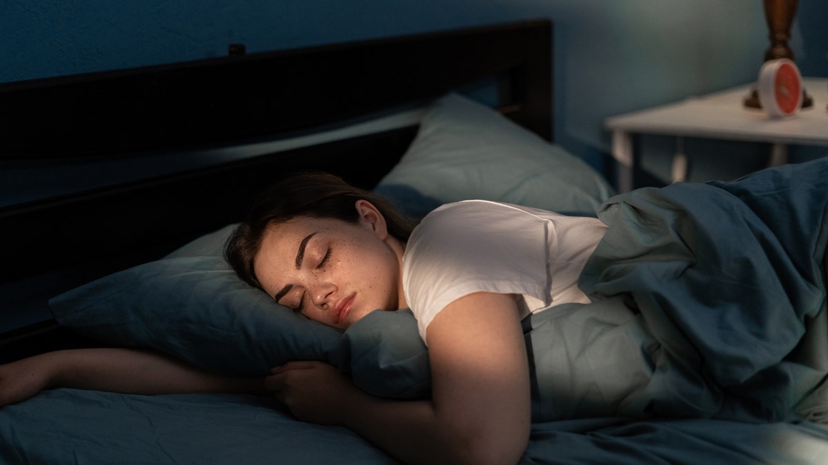 A woman sleeping on the bed